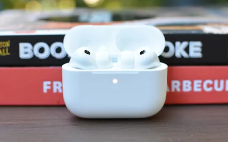 The iOS 27 settings screen displays the new AirPods equalizer controls with adjustable frequency sliders.