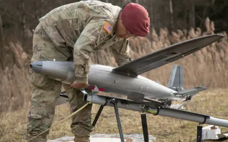 Technicians modify commercial drones at a decentralized field workshop to counter advancing electronic warfare systems.