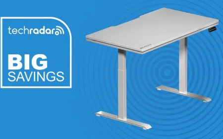 The Blacklyte Atlas Lite standing desk displays its dual motor frame and adjustable height range.