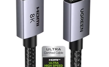 HDMI 2.1 cables with reinforced connectors and certification labels rest on a dark surface.