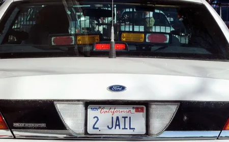 Law enforcement officers review data from automated license plate reader systems.