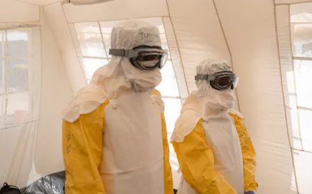 Healthcare workers in protective gear manage an Ebola treatment center in the Democratic Republic of Congo.