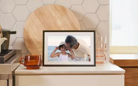 An Aura digital photo frame displays synchronized Google Photos albums via the new Ambient API.