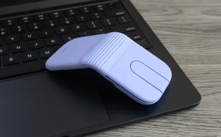 The Logitech Mobi Fold mouse is shown in its closed clamshell configuration, highlighting its compact pocket-sized design.