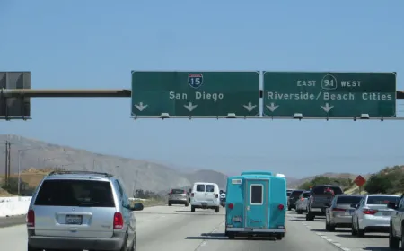 A ramp meter traffic signal regulates vehicle entry onto Interstate 15 in Riverside County.