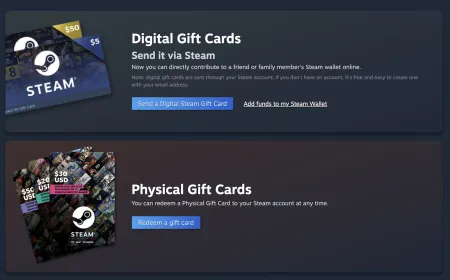 A physical Steam gift card rests on a desk beside a computer monitor.