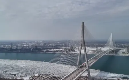 The Gordie Howe Bridge construction site spans the Detroit River between Canada and the United States.