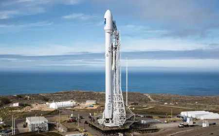 SpaceX rocket sits on the launch pad with financial charts in the background.