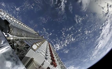 Lithuanian technicians assembling small satellite hardware for commercial space applications.