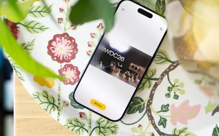 A smartphone displays the iOS 27 interface for artificial intelligence photo editing and spatial reframing tools.