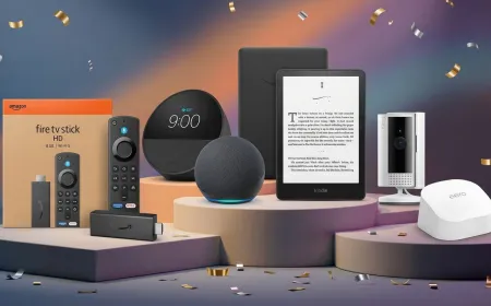 Assorted consumer electronics are arranged on a display table.