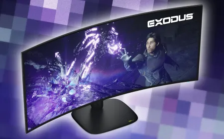 Alienware displays its new 39-inch 5K OLED monitor next to the updated 34-inch ultrawide model.