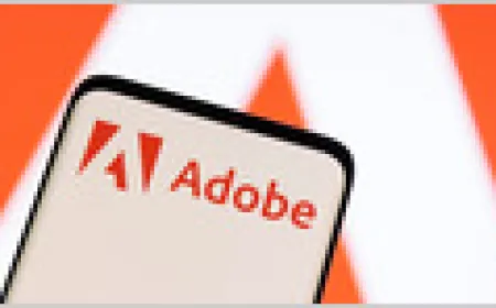 Adobe corporate logo displayed on a computer monitor screen