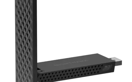 A collection of Wi-Fi 7 router accessories includes Ethernet cables, a network adapter, and a cooling pad.