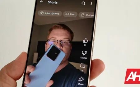 The YouTube Shorts interface displays a heart icon in place of the standard thumbs-up like button.