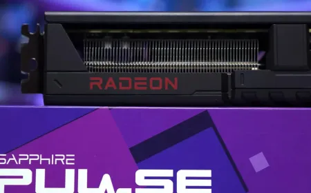 The AMD Radeon RX 9070 GRE graphics card is displayed at an angle with its silver and black cooling shroud visible.