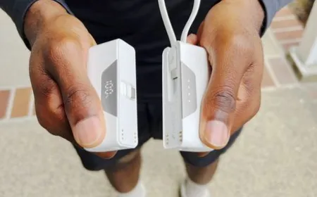 The Nimble SHAREPOWER charger is shown separated into two independent battery units on a flat surface.