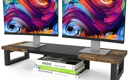 An adjustable metal shelf supports two monitors while routing cables neatly beneath the desk surface.