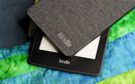A Kindle e-reader being modified by a user to extend its lifespan and bypass software restrictions.