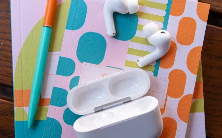 Apple AirPods Pro 3 wireless earbuds rest inside their charging case.