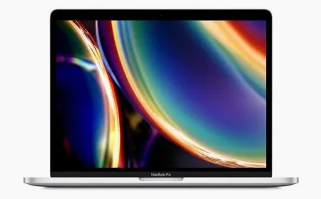 A silver 2020 MacBook Pro laptop rests closed with the Apple logo centered on the lid.