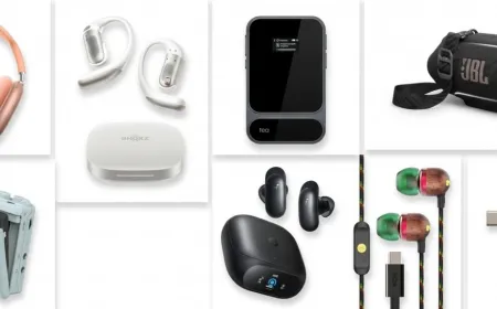 A collection of premium audio gear including headphones, speakers, and amplifiers sits on a display table.
