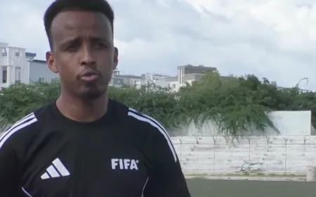 Somali referee Omar Artan denied entry to US despite valid visa, raising border policy and athletic merit concerns.