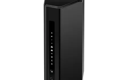 A wireless router and modem combo unit displays external antennas and multiple network ports.