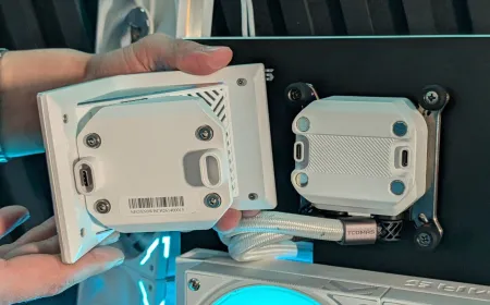 Cube-shaped EXIT D3 Pro AIO cooler with three integrated displays arranged along its inner half.