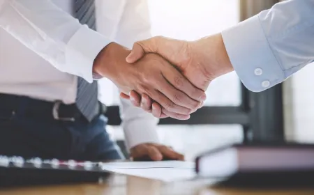 Nuvei and Payoneer logos representing the $2.75 billion acquisition deal