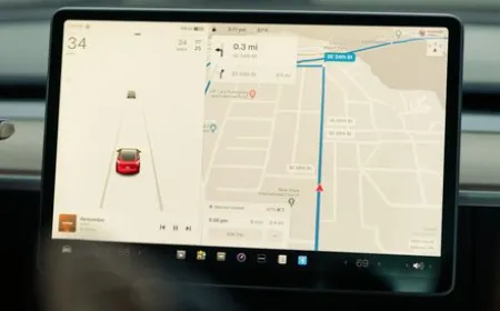 Miniature figurines positioned near a Tesla interior camera to bypass driver monitoring systems.