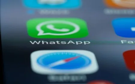 The iPhone screen shows the WhatsApp multi-account setup for managing two separate profiles.