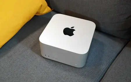 Front view of the Apple Mac Studio desktop computer with its compact aluminum chassis and rear connectivity ports.