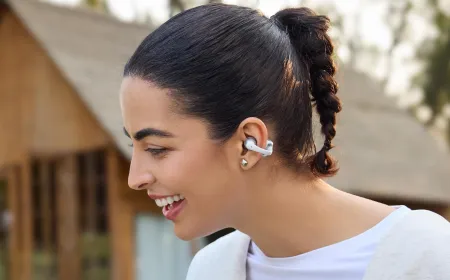 Shokz OpenDots Air and OpenDots 2 open-ear clip-on earbuds displayed side by side.