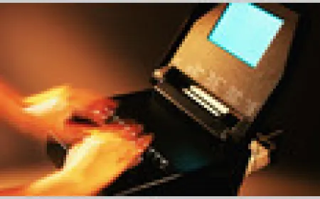 A court reporter operates a stenotype machine to capture testimony and gestures during a legal proceeding.