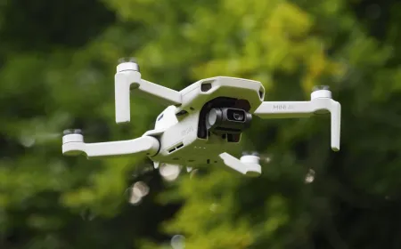 A drone sits near a World Cup stadium with a temporary no-fly zone warning sign.