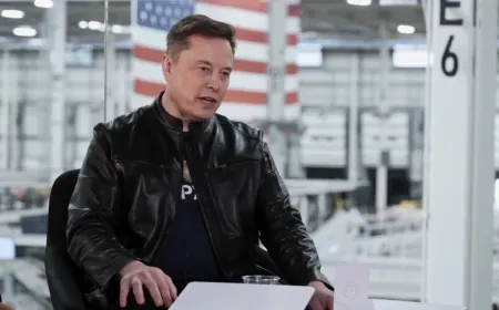Elon Musk stands near a SpaceX rocket after the company public debut.