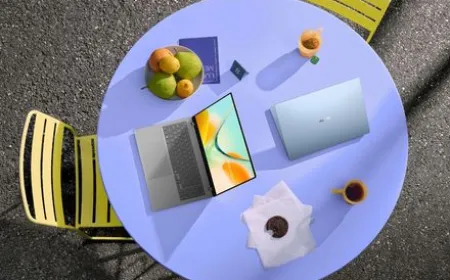 Asus Zenbook 14 laptop shown in Arctic Blue, Komodo Coral, and Zabriskie Beige finishes.