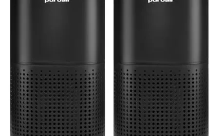 A compact air purifier sits on a home office desk to improve indoor air quality during extended work sessions.