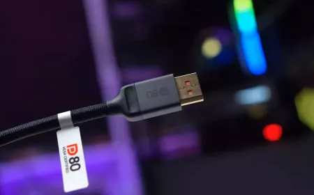 DisplayPort cable connected to a graphics card and monitor, showing how cable choice impacts UHBR20 performance.