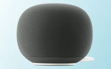 The photo displays Google's new Gemini-powered Home smart speaker.