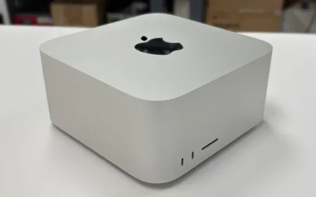 The compact Mac Studio desktop computer displays its rear connectivity ports.