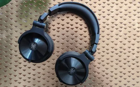 OneOdio Studio Max 2 over-ear headphones displayed with their wireless monitoring transmitter