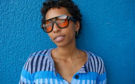 Minimalist smart glasses with a sleek frame and discreet sensors enable hands-free ambient computing.