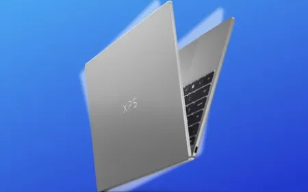 The Dell XPS 13 laptop is displayed open to show its slim chassis and backlit keyboard.