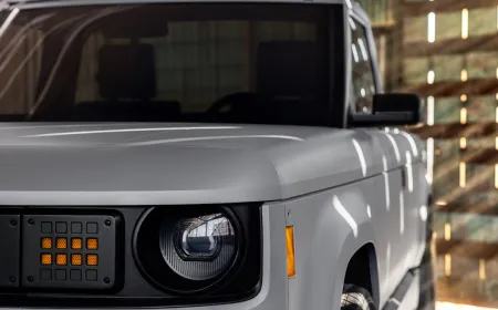 The minimalist electric pickup truck displays a clean exterior profile with no external antennas or tracking hardware.