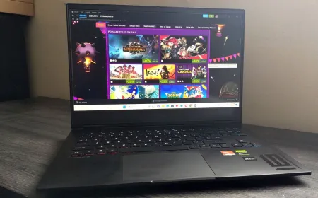 The HP Omen 16 laptop sits open on a desk, displaying its keyboard, screen, and side ports.