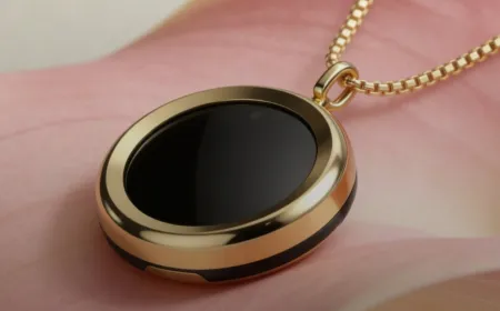 A compact smart necklace worn around the neck monitors daily ultraviolet exposure levels.
