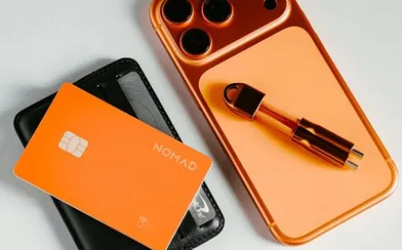 Nomad Stellar Orange Tracking Card Pro and Stand One charger displayed together