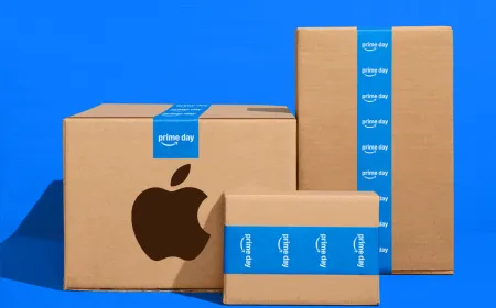 This promotional banner displays discounted Apple M5 MacBooks, iPads, and wearables for Prime Day 2026.